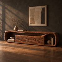 Capsule shaped media console with wave carved center panels and open end cubbies, three-quarter view showing the grain
