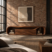 Capsule shaped media console with wave carved center panels and open end cubbies in an industrial loft living room with exposed brick