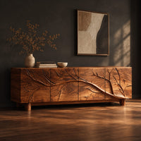 Tv stand with a carved branch relief across four front panels, three-quarter view showing the grain