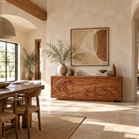 Sideboard with a breaking wave carved across three doors in a bright open plan dining room