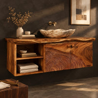 Corner detail of floating cabinet with two carved contour doors and an open shelf bay beside wood, brass and linen samples
