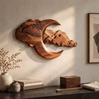Detail of carved crescent moon wall art with a bank of layered scalloped clouds beside wood, brass and linen samples