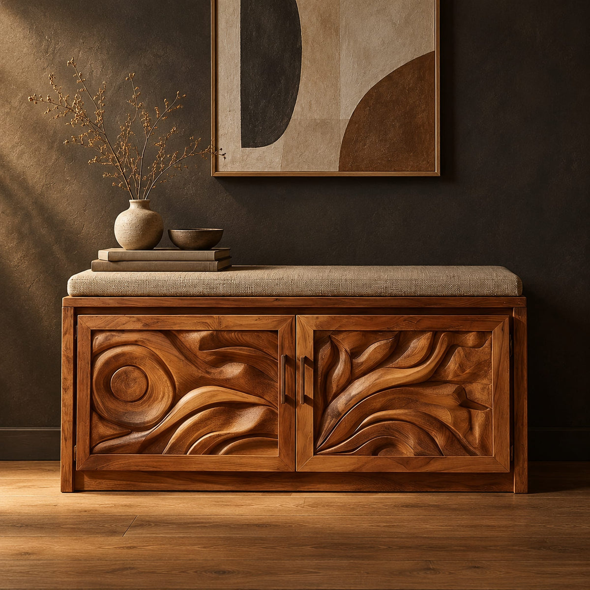 Shoe bench with two carved relief doors and a padded seat on top in a dark studio against a charcoal plaster wall