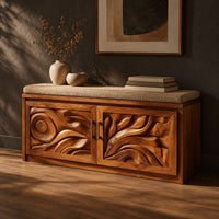 Shoe bench with two carved relief doors and a padded seat on top, three-quarter view showing the grain