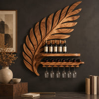 Corner detail of carved leaf shaped wine rack with a long shelf and a rail for stemware beside wood, brass and linen samples
