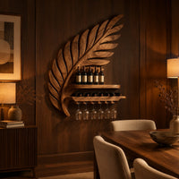 Carved leaf shaped wine rack with a long shelf and a rail for stemware in an evening dining room with walnut wall paneling
