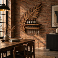 Carved leaf shaped wine rack with a long shelf and a rail for stemware in an industrial loft dining room with exposed brick