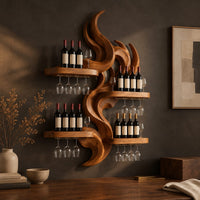 Corner detail of carved wood flame wine rack with four wide shelves reaching out from the center beside wood, brass and linen samples