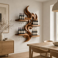 Carved wood flame wine rack with four wide shelves reaching out from the center in a Scandinavian dining room with white walls