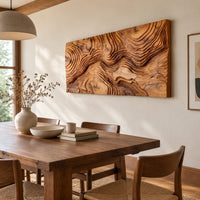 Wide wood relief wall art carved with flowing contour ridges beside a dining table in natural light
