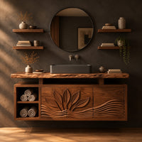 Bathroom vanity cabinet with a carved leaf pattern and a raised live edge top in a dark studio against a charcoal plaster wall