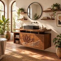 Bathroom vanity cabinet with a carved leaf pattern and a raised live edge top in a bright bathroom with arched windows and plants