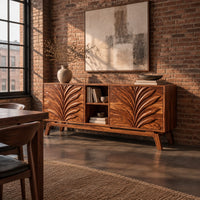 Sideboard with two leaf carved panels and an open center shelf unit in an industrial loft dining room with exposed brick