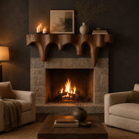 Mantel shelf with tapered drip arches and a rough grooved face in a dark living room at golden hour