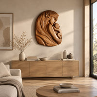 Wall art carved as a mother holding her child, with long flowing hair above a light oak sideboard in daylight