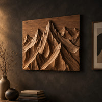 Wood wall art with carved mountain peaks in deep relief on a dark charcoal plaster wall