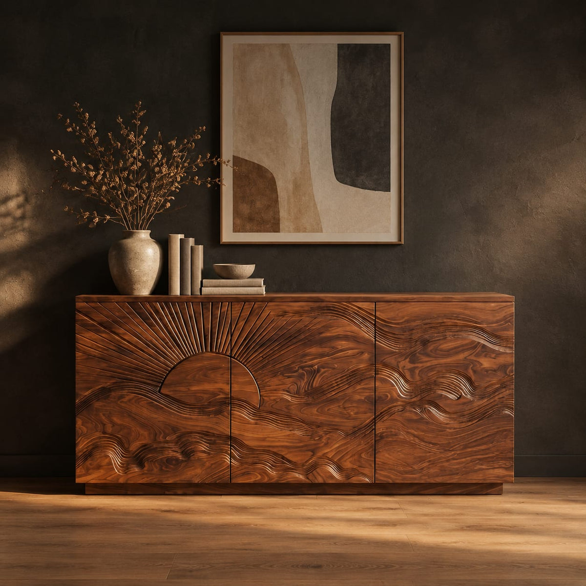Sideboard with a carved sunrise and rolling waves across three doors in a dark studio against a charcoal plaster wall