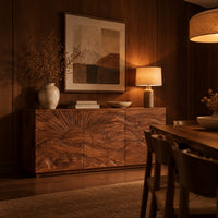 Sideboard with a carved sunrise and rolling waves across three doors in an evening dining room with walnut wall paneling
