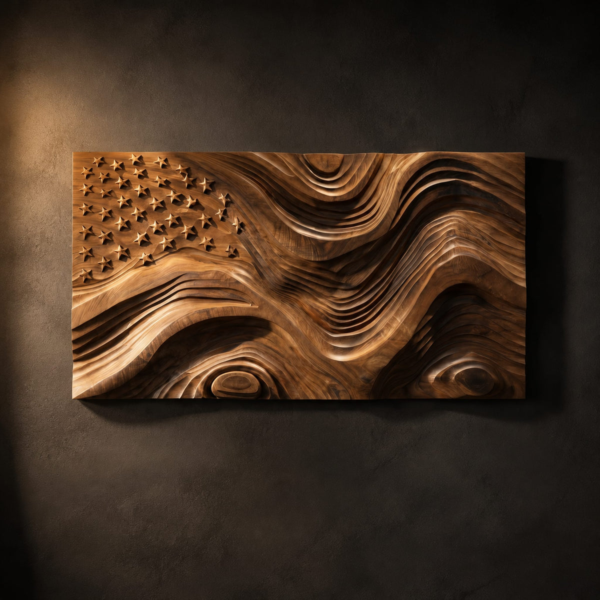 Rectangular relief wall art with carved stars and rippling wave stripes on a dark charcoal plaster wall