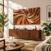 Landscape wood wall art panel with a carved swirl relief in a bright sunroom with green plants