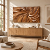 Landscape wood wall art panel with a carved swirl relief above a light oak sideboard in daylight