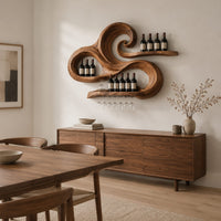 Carved wooden wine rack with a swirling wave shape and a stemware rail in a Scandinavian dining room with white walls