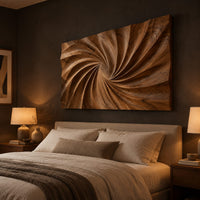 Wall art panel with a swirling carved ridge pattern radiating from the center above a bed in a dusk lit bedroom