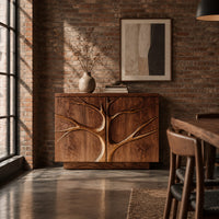 Two door sideboard with a carved tree branch relief across the fronts in an industrial loft dining room with exposed brick