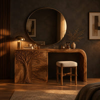 Carved tree makeup vanity with three drawers and an open knee space in a dark bedroom at golden hour