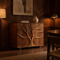Two door sideboard with a carved tree branch relief in an evening dining room with walnut wall paneling