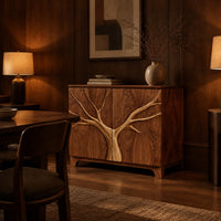 Two door sideboard with a tree carved in relief across both doors in an evening dining room with walnut wall paneling