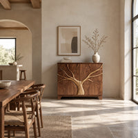 Two door sideboard with a tree carved in relief across both doors in a bright open plan dining room
