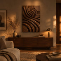 Carved wooden wall panel with sweeping layered grooves above a low console in an evening living room