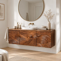 Floating bathroom vanity cabinet with three carved wave front panels in a Scandinavian bathroom with white walls