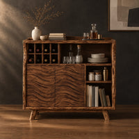 Bar cabinet with carved wave doors, a wine slot grid and open shelves in a dark studio against a charcoal plaster wall