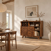 Bar cabinet with carved wave doors, a wine slot grid and open shelves in a bright open plan dining room