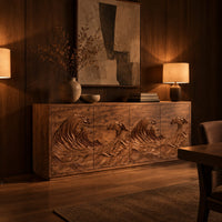 Sideboard with four doors carved in a rolling ocean wave relief in an evening dining room with walnut wall paneling