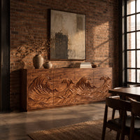 Sideboard with four doors carved in a rolling ocean wave relief in an industrial loft dining room with exposed brick