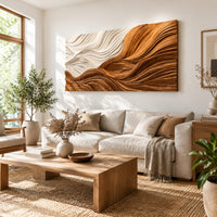 Rectangular carved wave panel with flowing ridges from light to dark in a bright sunroom with green plants