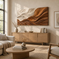 Rectangular carved wave panel with flowing ridges from light to dark above a light oak sideboard in daylight