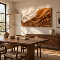 Rectangular carved wave panel with flowing ridges from light to dark beside a dining table in natural light