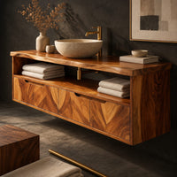 Corner detail of floating cabinet with open shelf above four chevron grain fronts beside wood, brass and linen samples
