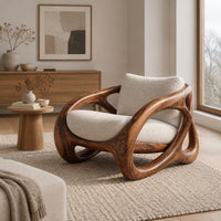 Chunky looped wood frame chair with oval openings and a cream seat in a Scandinavian living room with white walls