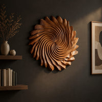 Circular wall art with spiral petal carving and a ruffled edge, three-quarter view showing the carved depth