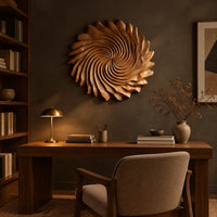 Circular wall art with spiral petal carving and a ruffled edge above a desk in a dark study corner