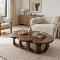 Cloud shaped coffee table on a base of round arches in a Scandinavian living room with white walls