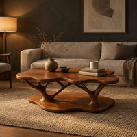 Coffee table with a cloud shaped top and branching legs in a dark living room at golden hour
