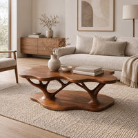 Coffee table with a cloud shaped top and branching legs in a Scandinavian living room with white walls