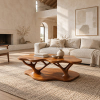 Coffee table with a cloud shaped top and branching legs in a bright open plan living room
