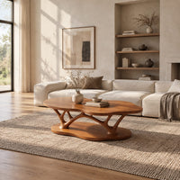 Cloud shaped coffee table with forked branch legs over a matching shaped base in a bright open plan living room